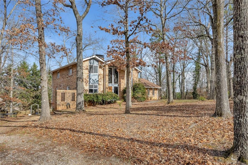 1113 Honeysuckle Drive Canton, GA 30114 - Photo 53 of 57 front view of a house with a yard