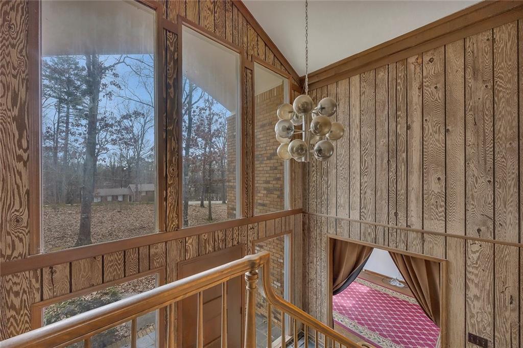 1113 Honeysuckle Drive Canton, GA 30114 - Photo 6 of 57 a view of a balcony with wooden floor and door