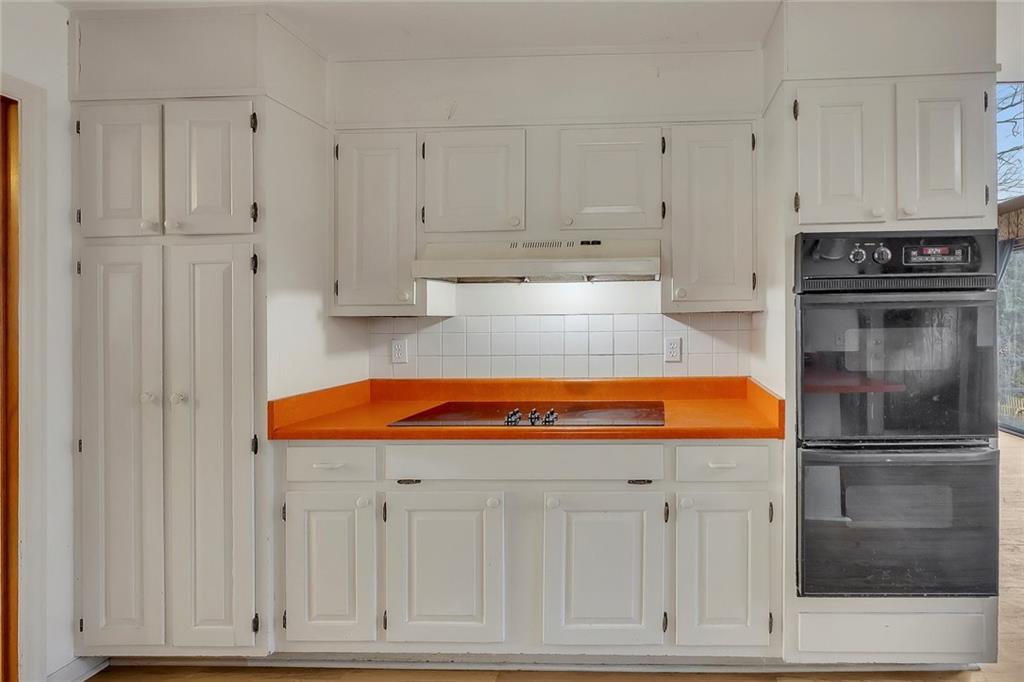 1113 Honeysuckle Drive Canton, GA 30114 - Photo 9 of 57 a kitchen with stainless steel appliances granite countertop a refrigerator a stove and white cabinets