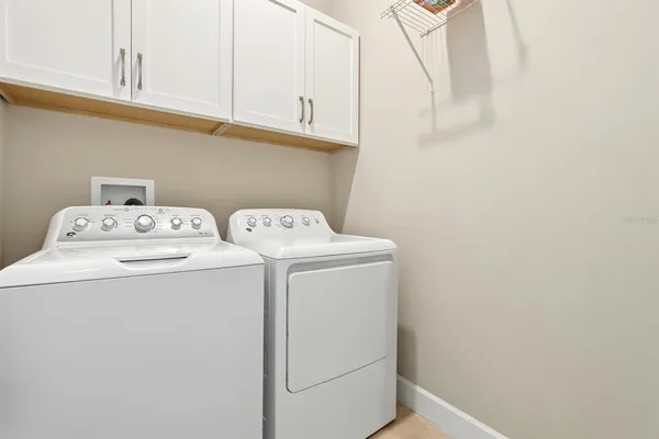 a bathroom with a tub a sink and a shower
