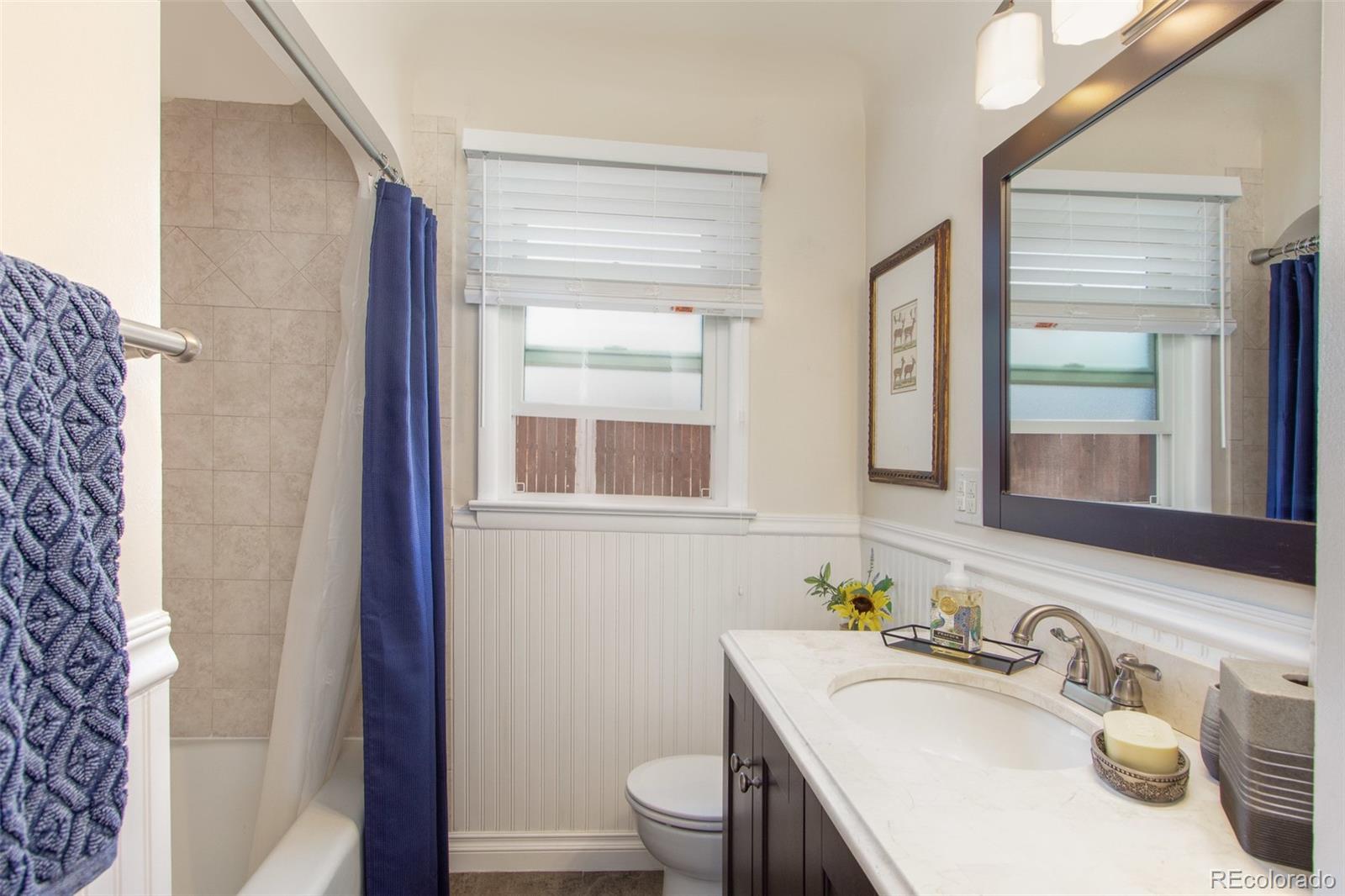 1635 Montview Road Greeley, CO 80631 - Photo 13 of 25 a bathroom with a sink and a toilet