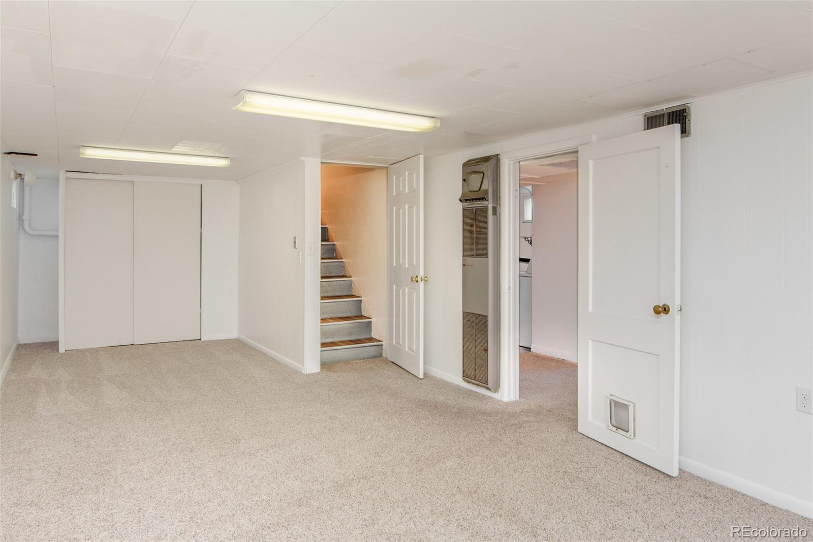 1635 Montview Road Greeley, CO 80631 - Photo 18 of 25 wooden floor and closet area in a room