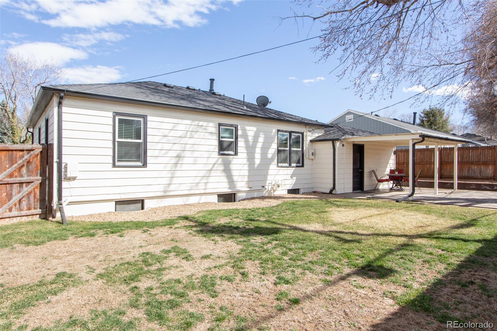 1635 Montview Road Greeley, CO 80631 - Photo 23 of 25 a front view of a house with a yard
