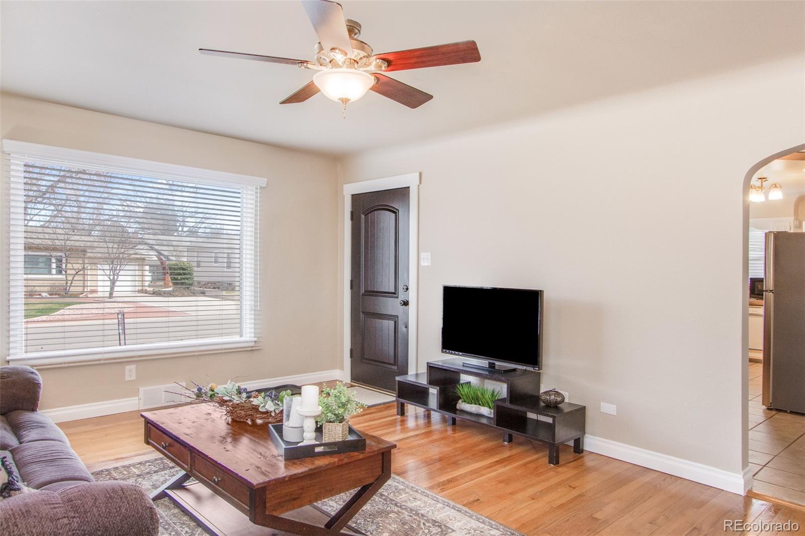 1635 Montview Road Greeley, CO 80631 - Photo 6 of 25 a living room with furniture and a flat screen tv