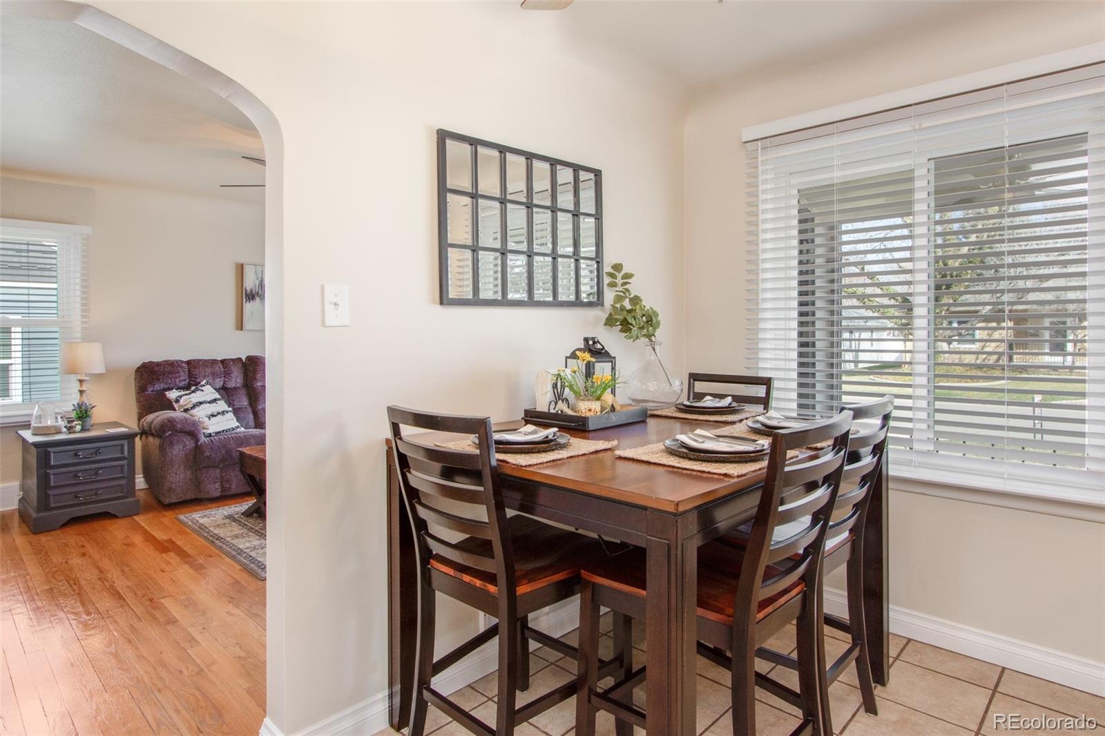 1635 Montview Road Greeley, CO 80631 - Photo 10 of 25 a view of a dining room and hall with wooden floor