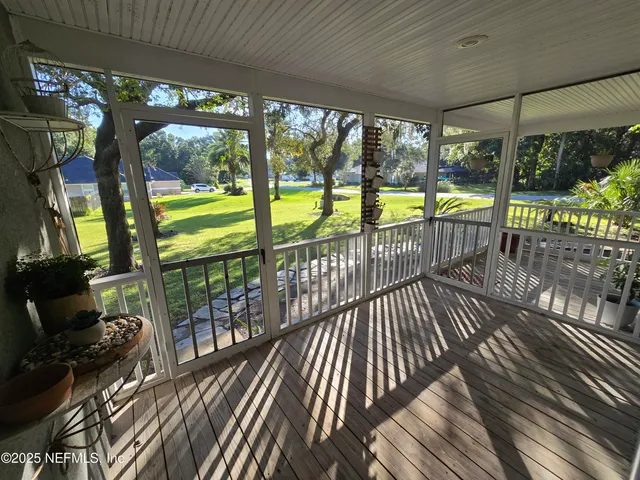 a bedroom with furniture and a wooden floor