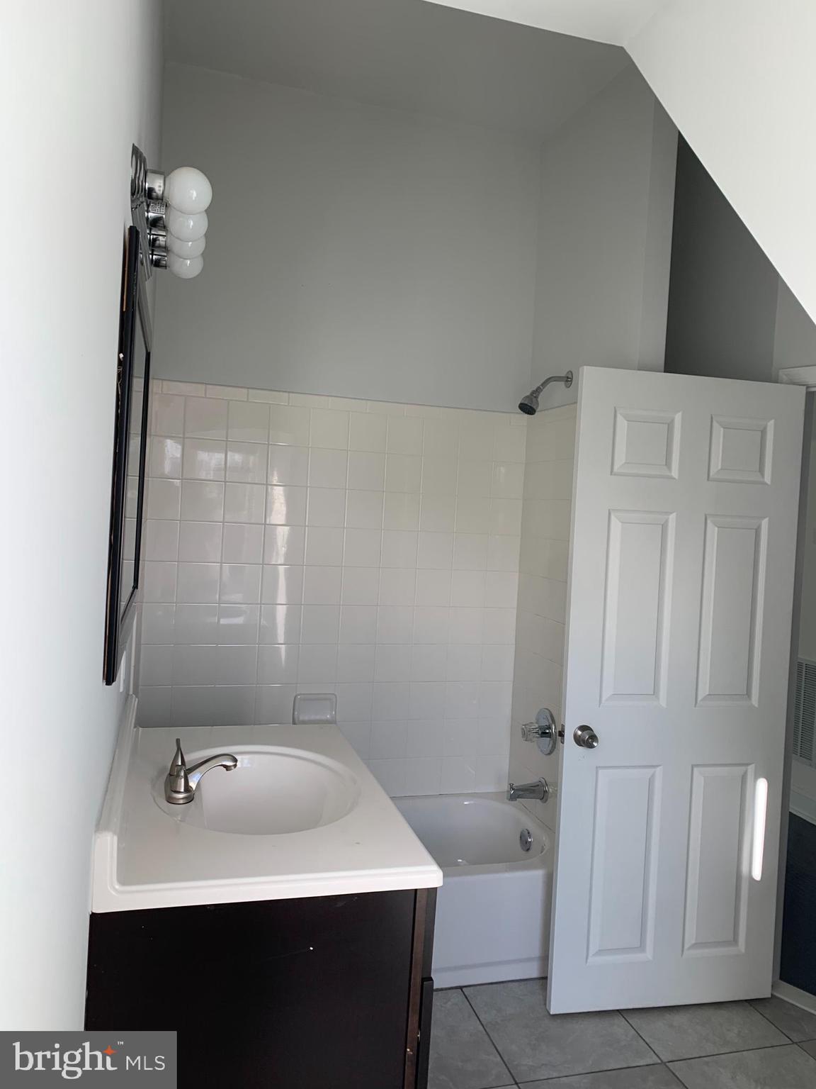 35 Windermere Avenue Lansdowne, PA 19050 - Photo 11 of 13 a bathroom with a sink and mirror