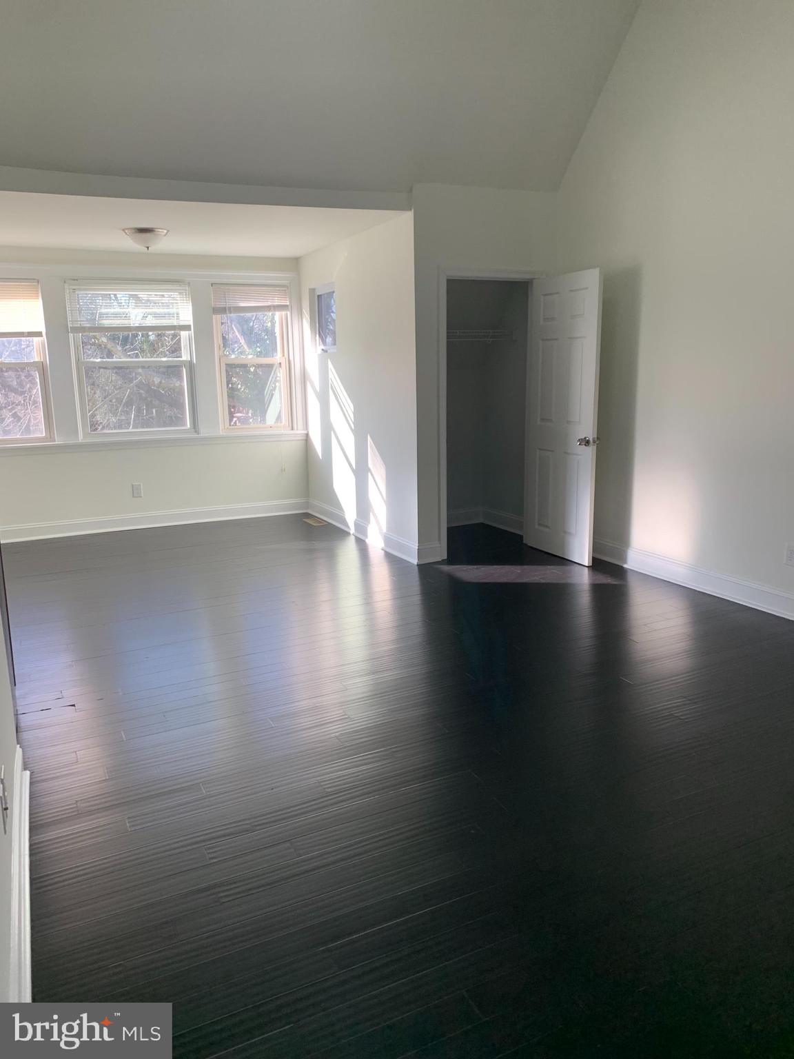35 Windermere Avenue Lansdowne, PA 19050 - Photo 4 of 13 a view of an empty room with wooden floor and a window