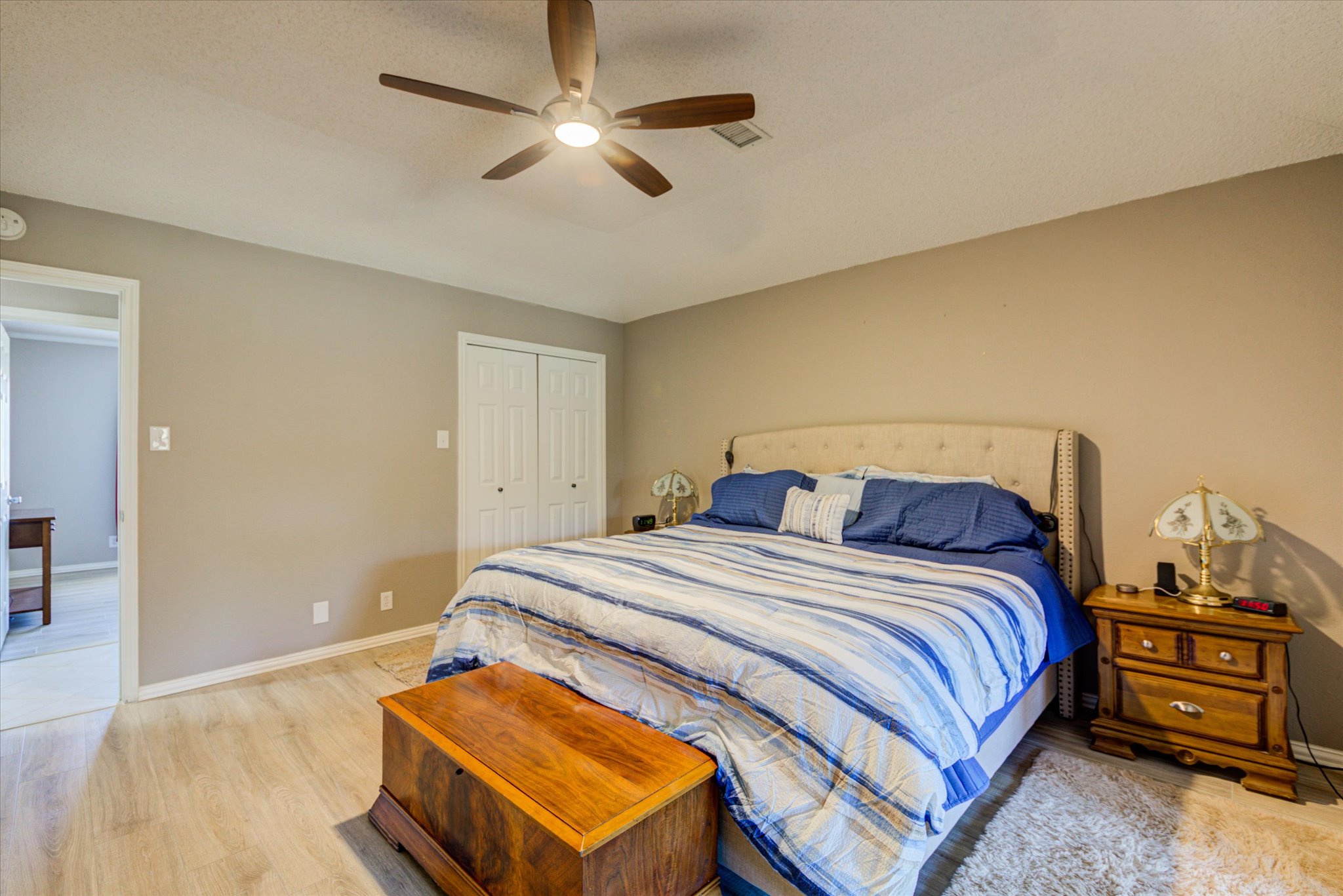 200 Harbor Circle Georgetown, TX 78633 - Photo 11 of 38 a bedroom with a bed and a chandelier