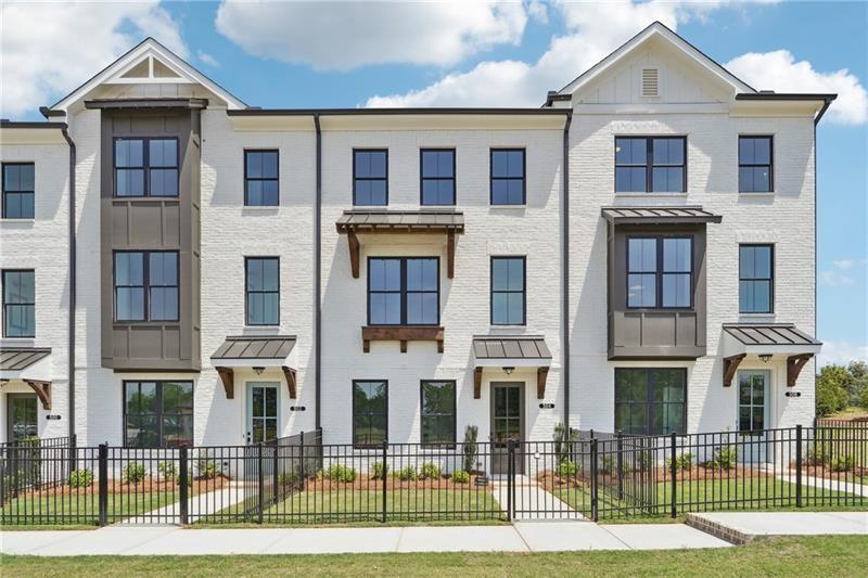 504 Healy Drive Cumming, GA 30040 - Photo 1 of 25 a view of a brick house with many windows