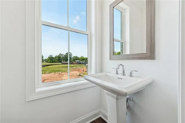 a bathroom with a sink and a window