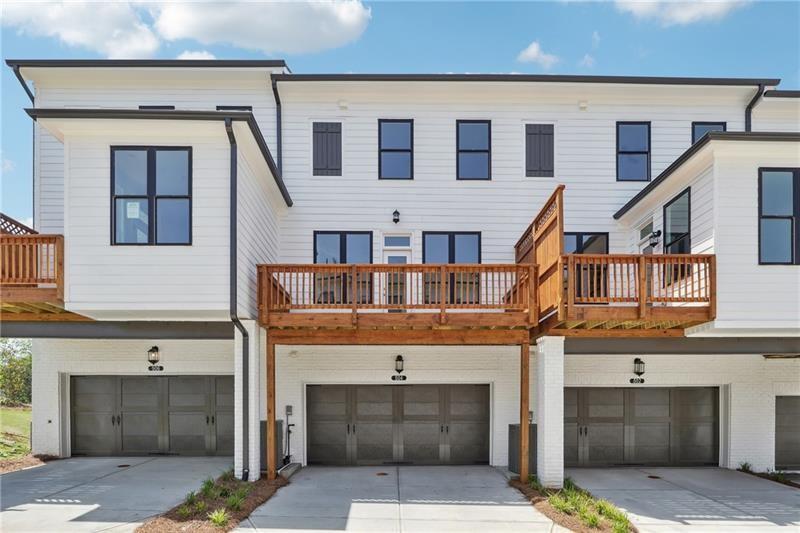 504 Healy Drive Cumming, GA 30040 - Photo 25 of 25 a view of building with glass windows and a fireplace