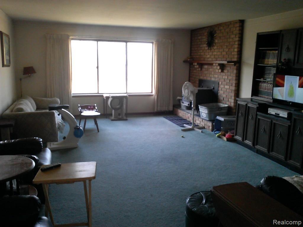 9260 Springborn Road Casco, MI 48064 - Photo 16 of 29 Living room with wood stove