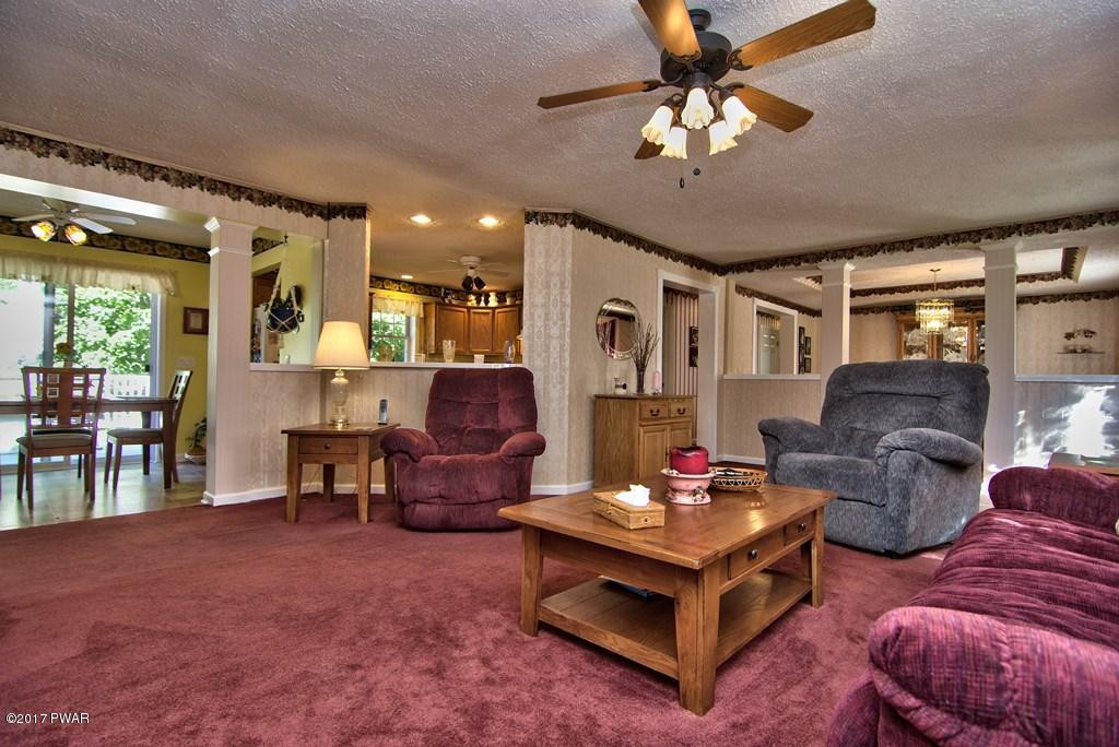 145 Keystone Road Lake Ariel, PA 18436 - Photo 4 of 52 a living room with furniture and a chandelier