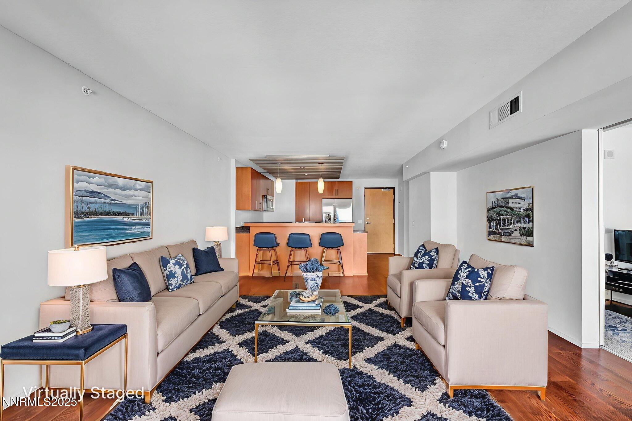 255 North Sierra Street, Unit 1908 Reno, NV 89501 - Photo 12 of 55 a living room with furniture and a large window