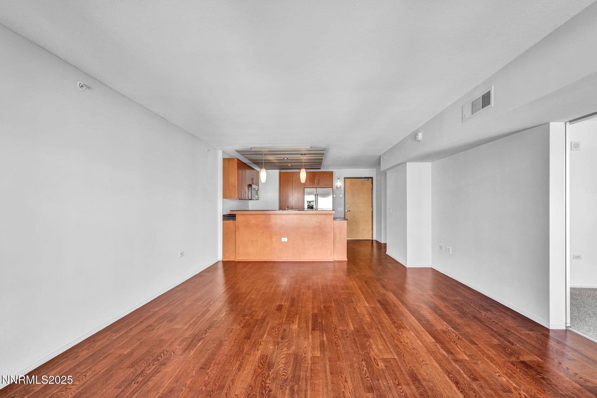 255 North Sierra Street, Unit 1908 Reno, NV 89501 - Photo 14 of 55 a view of empty room with wooden floor
