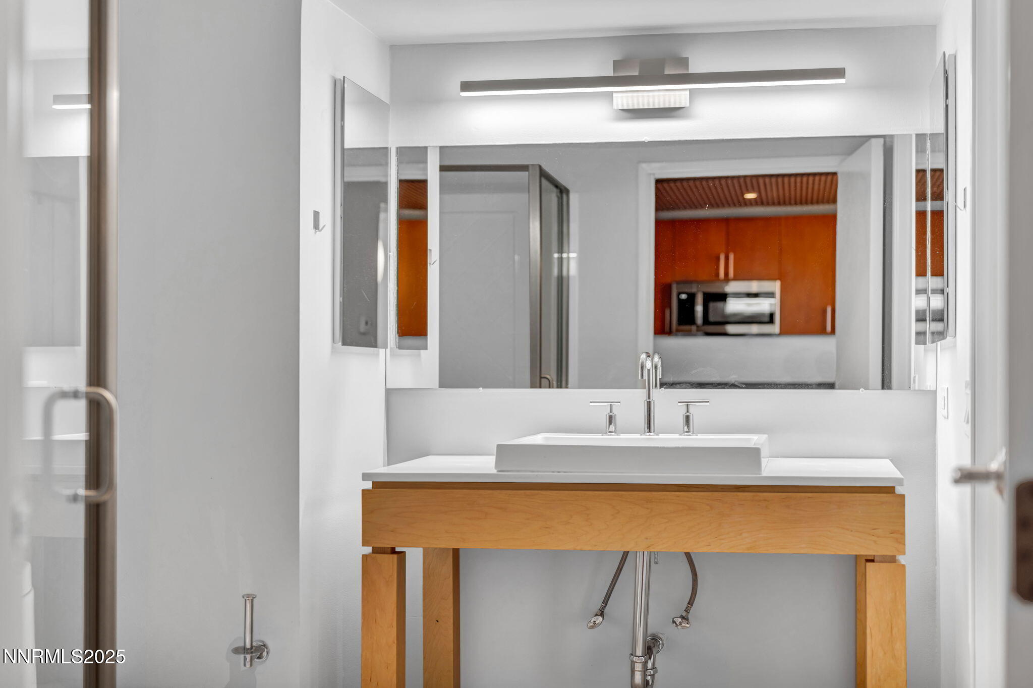255 North Sierra Street, Unit 1908 Reno, NV 89501 - Photo 22 of 55 a bathroom with a sink and a mirror