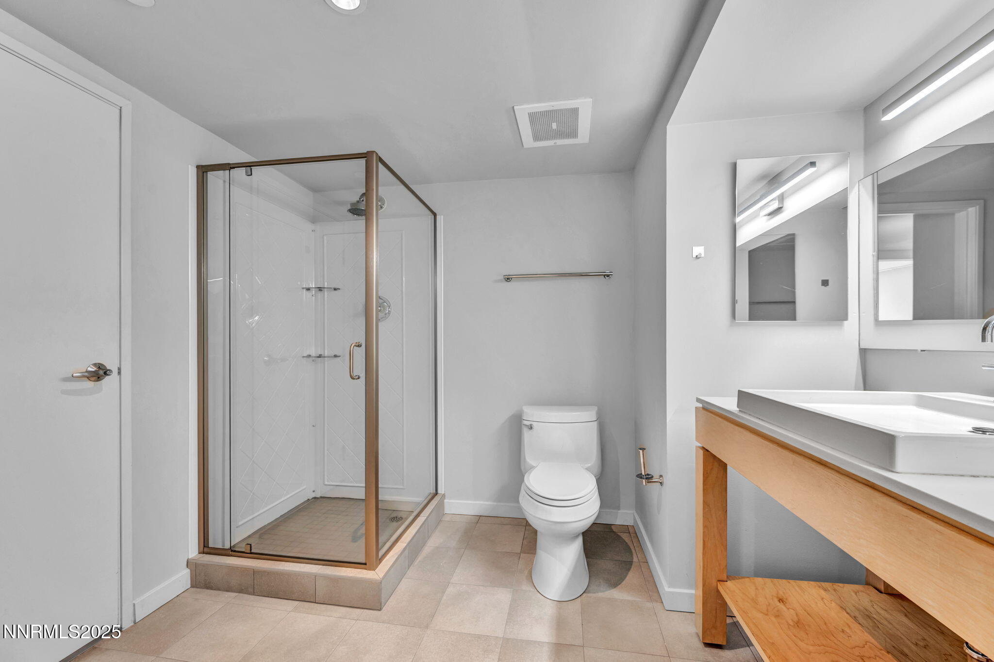 255 North Sierra Street, Unit 1908 Reno, NV 89501 - Photo 24 of 55 a spacious bathroom with a granite countertop sink a toilet and a shower