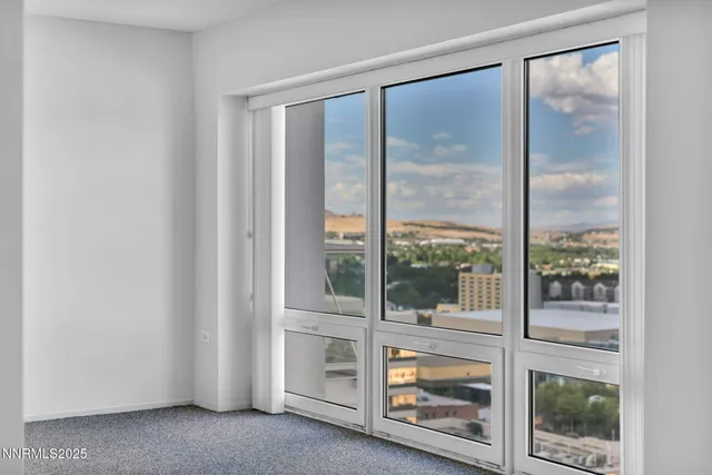 a view of an empty room with a fireplace