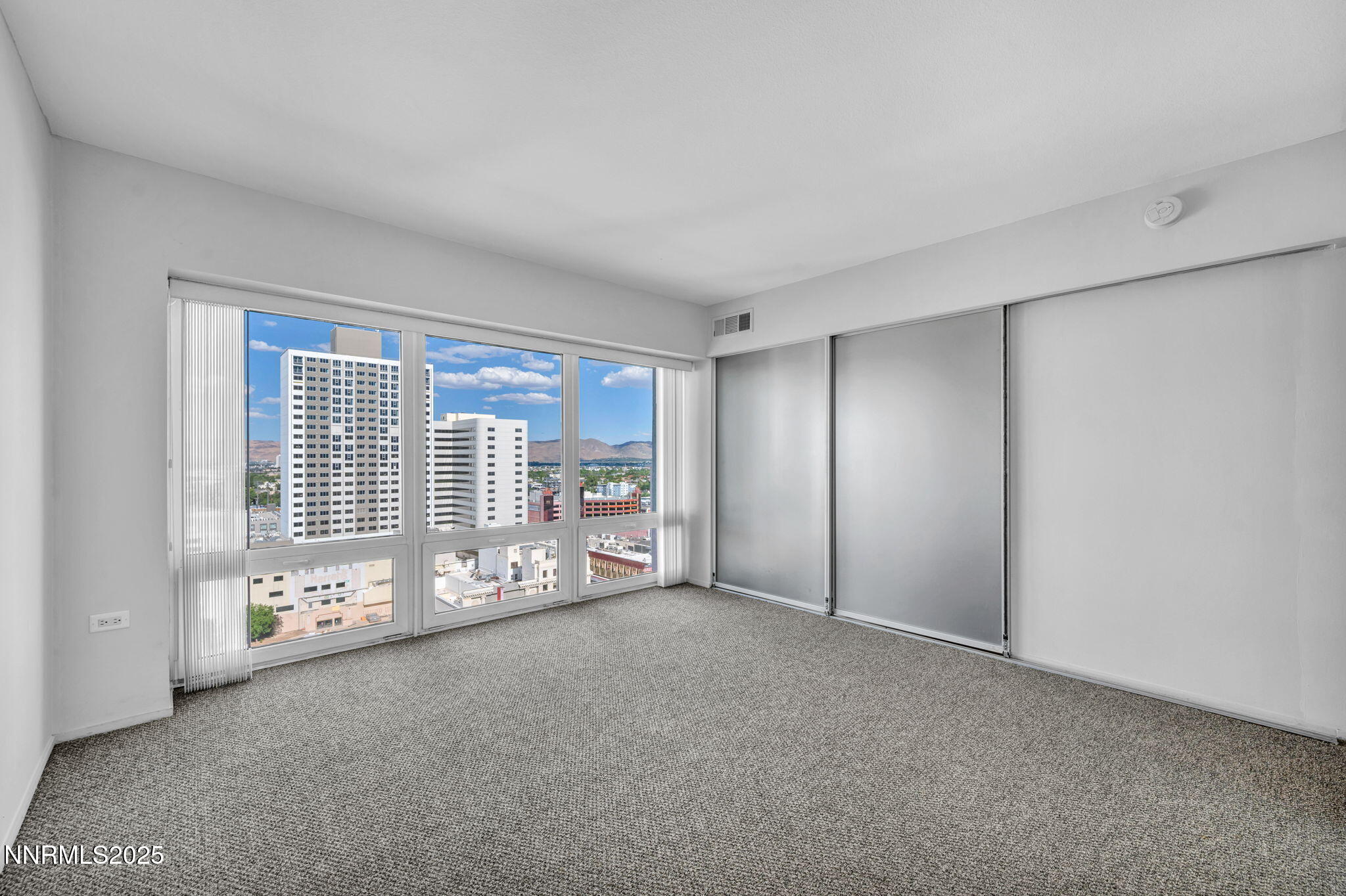 255 North Sierra Street, Unit 1908 Reno, NV 89501 - Photo 34 of 55 a view of an empty room with a fireplace