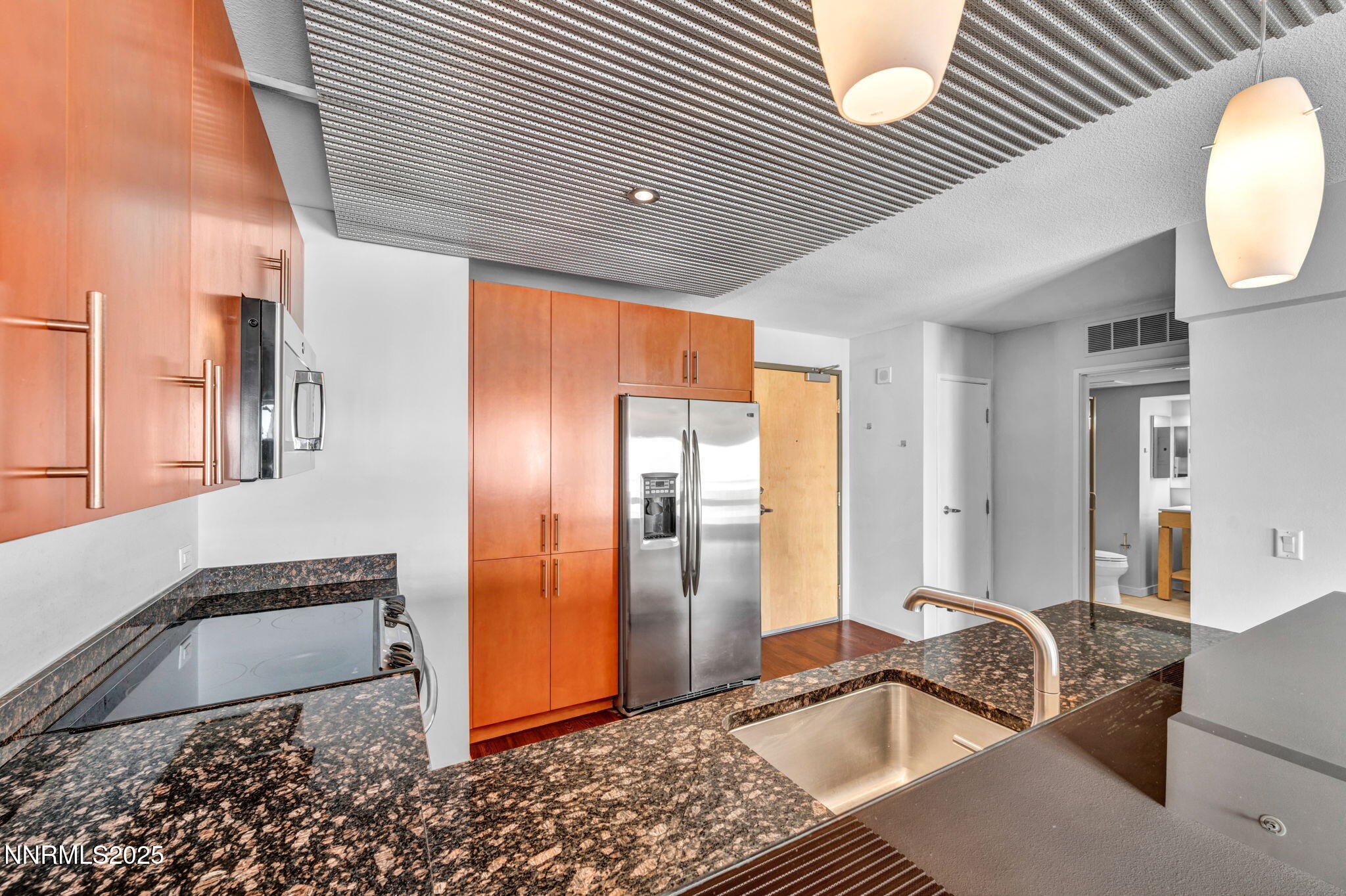 255 North Sierra Street, Unit 1908 Reno, NV 89501 - Photo 6 of 55 a room with stainless steel appliances granite countertop a sink and cabinets