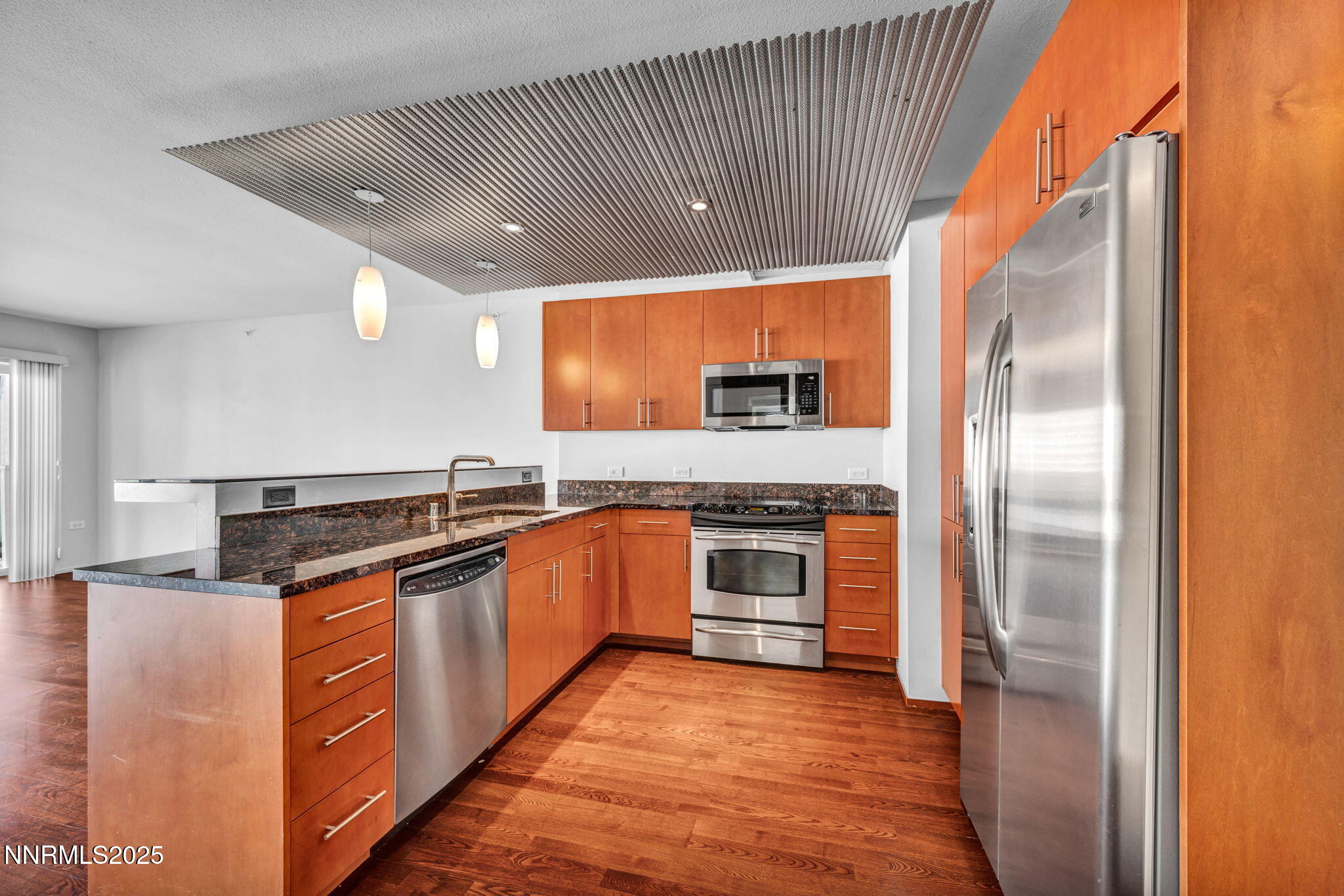 255 North Sierra Street, Unit 1908 Reno, NV 89501 - Photo 7 of 55 a kitchen with stainless steel appliances granite countertop a refrigerator and a sink