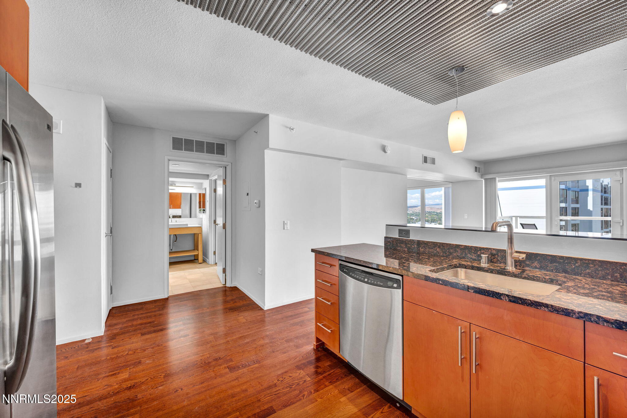 255 North Sierra Street, Unit 1908 Reno, NV 89501 - Photo 9 of 55 a kitchen with granite countertop a sink and cabinets