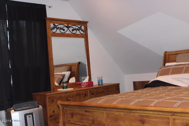 1295 Brookfield Road Lake Ariel, PA 18436 - Photo 5 of 26 a bedroom with a bed and dresser