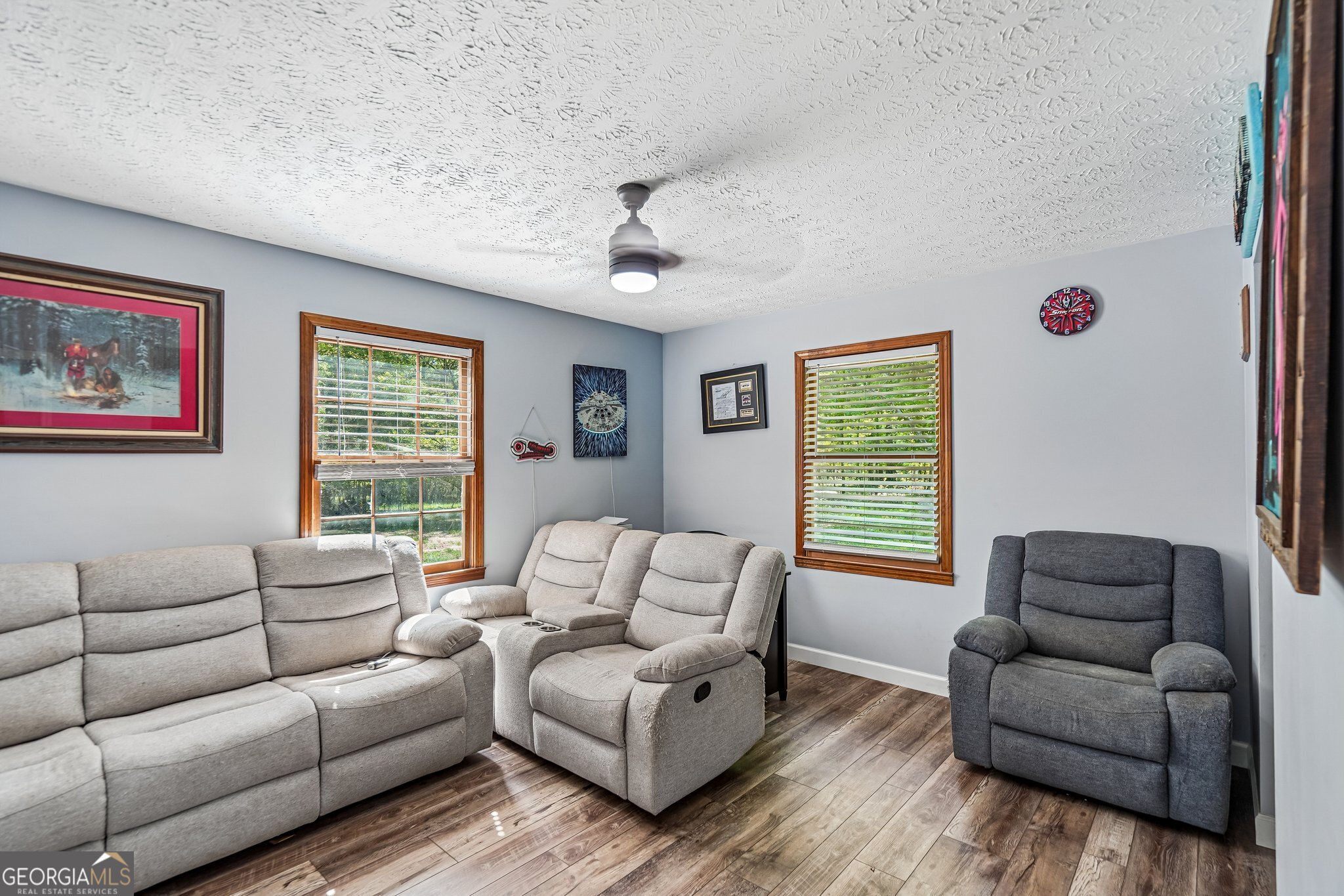 241 Busbin Road Fayetteville, GA 30215 - Photo 19 of 45 a living room with furniture ceiling fan and a window