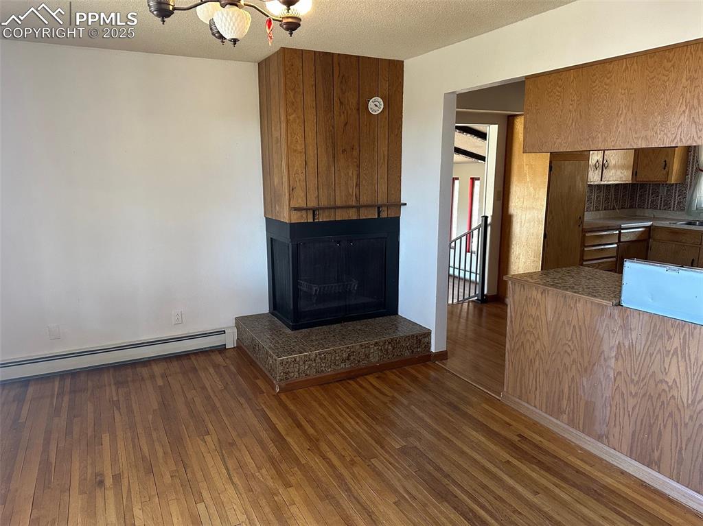 14165 Roller Coaster Road Colorado Springs, CO 80921 - Photo 5 of 12 a view of an entryway with wooden floor