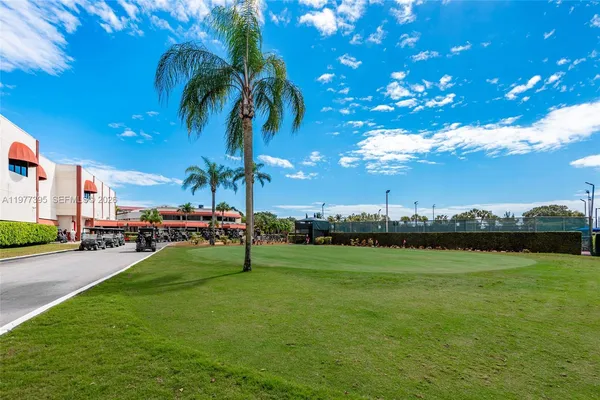 a bedroom with a large bed and a large window