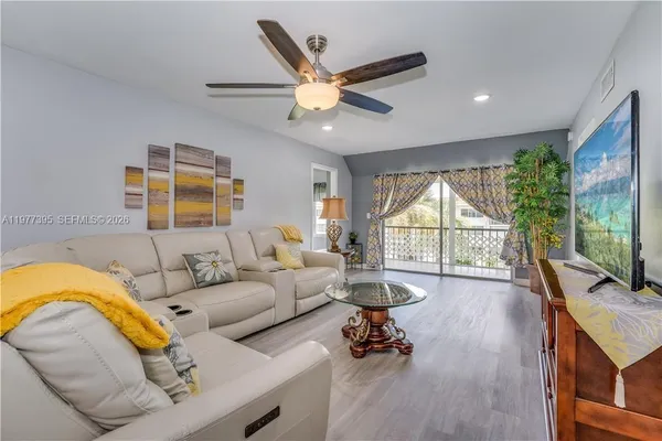 a living room with furniture and a large window