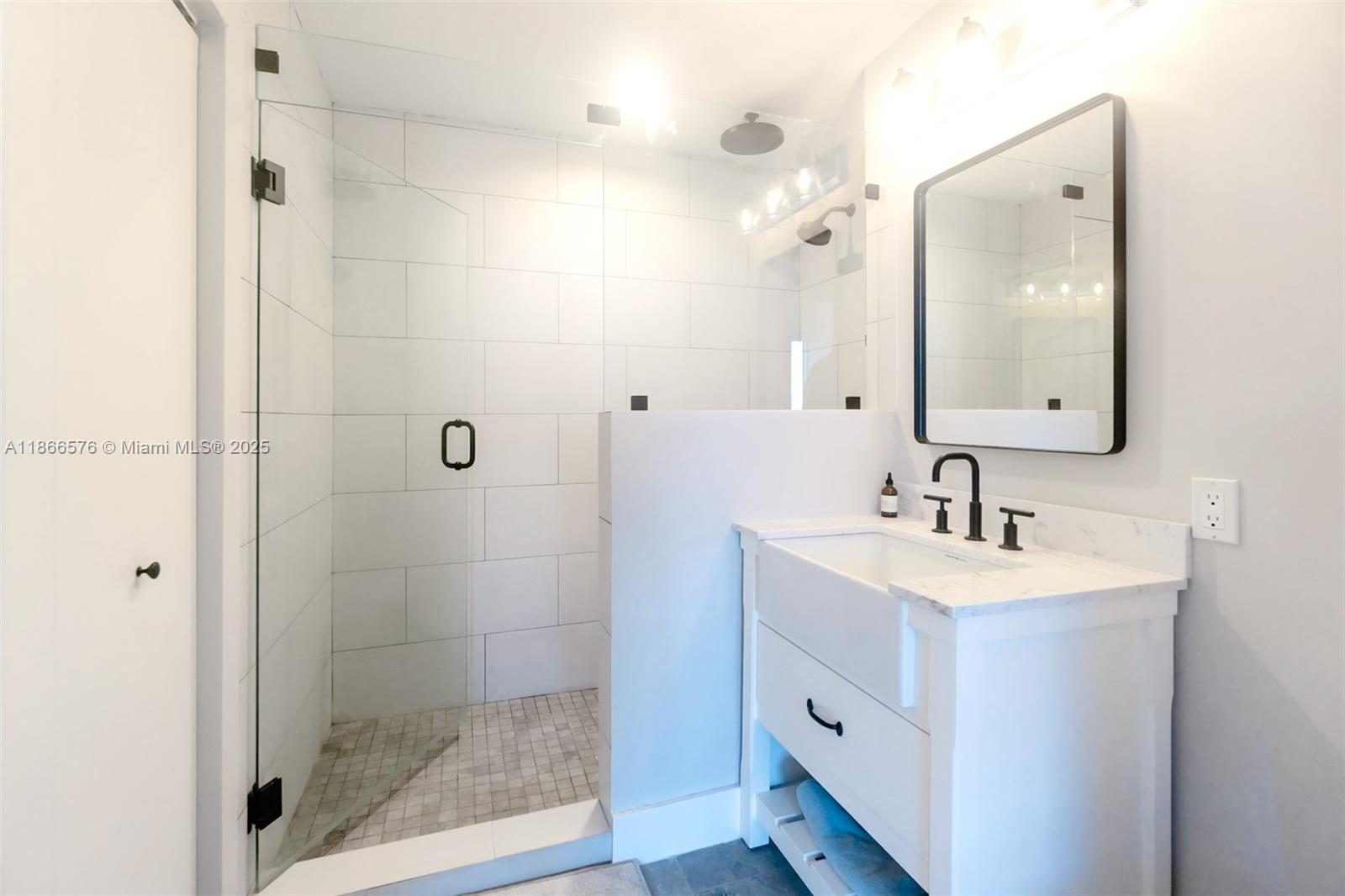 60 Southwest 13th Street, Unit 4802 Miami, FL 33130 - Photo 11 of 23 a bathroom with a sink double vanity and a mirror