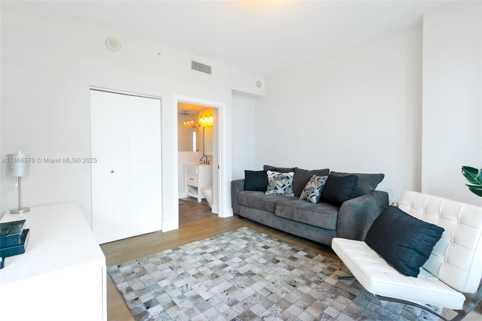 60 Southwest 13th Street, Unit 4802 Miami, FL 33130 - Photo 13 of 23 a living room with a couch and a couch