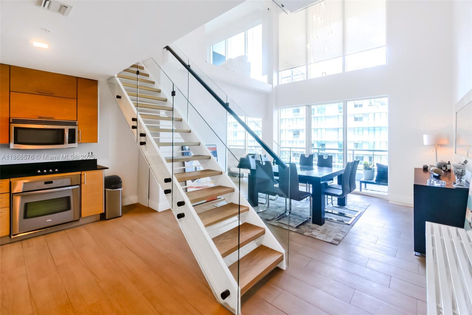 60 Southwest 13th Street, Unit 4802 Miami, FL 33130 - Photo 2 of 23 a living room with furniture and a fireplace