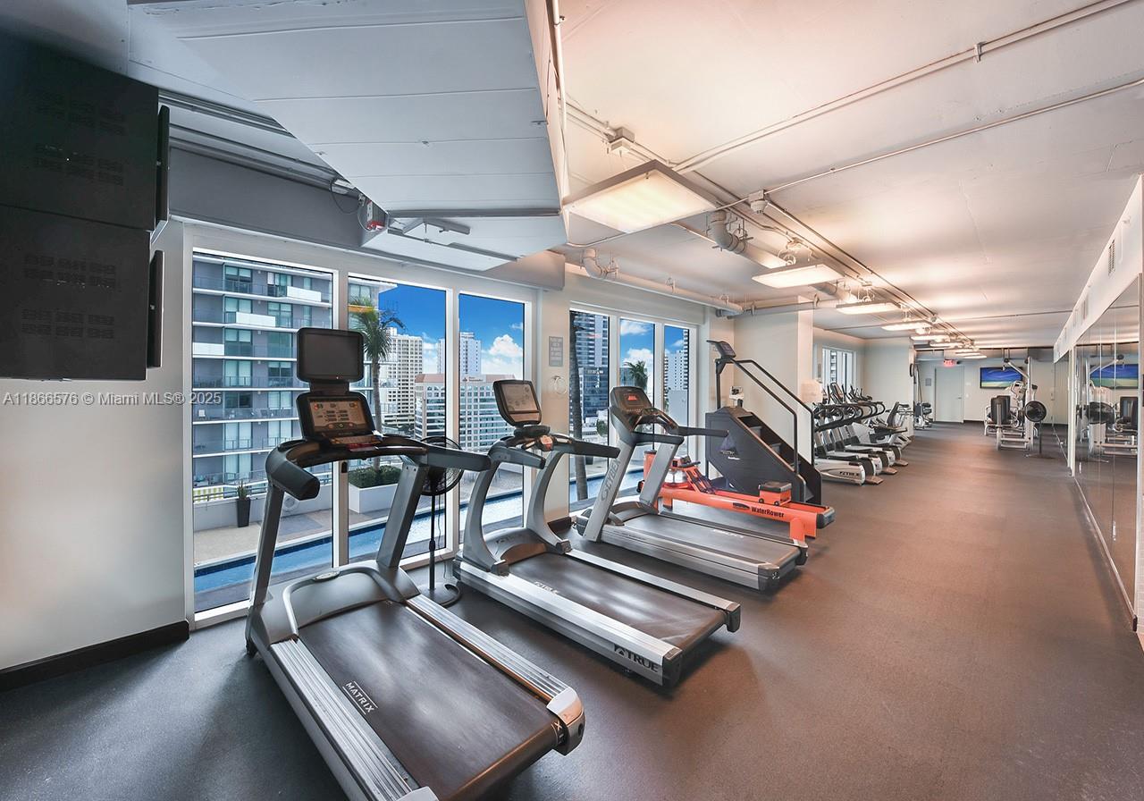 60 Southwest 13th Street, Unit 4802 Miami, FL 33130 - Photo 22 of 23 a view of a room with gym equipment