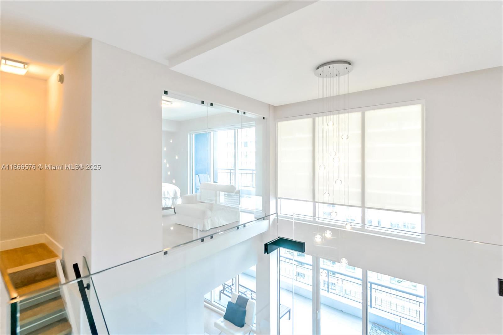 60 Southwest 13th Street, Unit 4802 Miami, FL 33130 - Photo 6 of 23 a large white kitchen with a large window