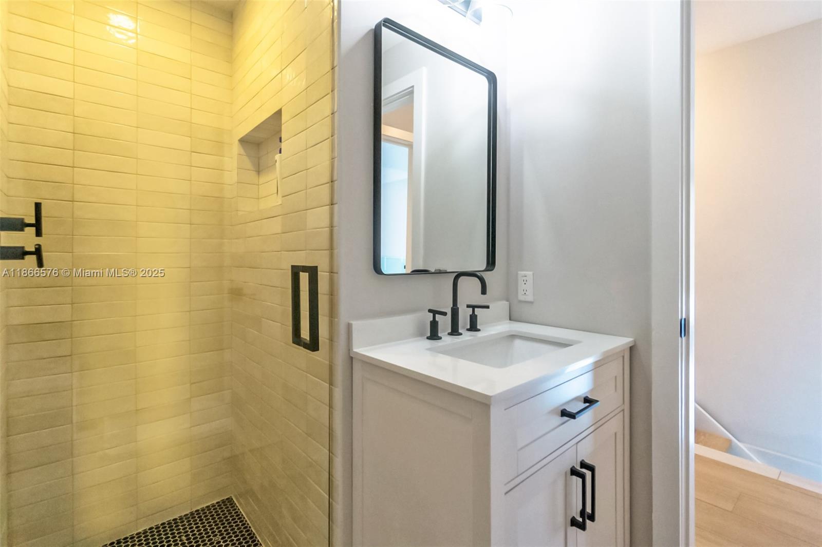 60 Southwest 13th Street, Unit 4802 Miami, FL 33130 - Photo 8 of 23 a bathroom with a sink and a mirror