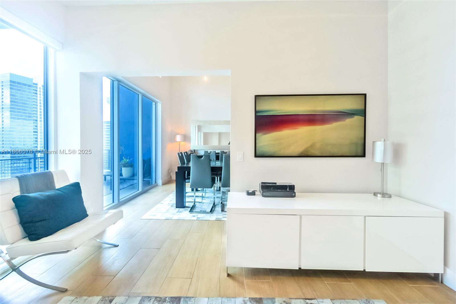 60 Southwest 13th Street, Unit 4802 Miami, FL 33130 - Photo 9 of 23 a living room with furniture and a flat screen tv