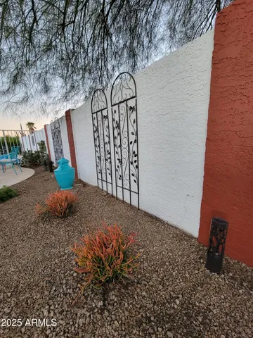 a view of a room with rack and potted plant
