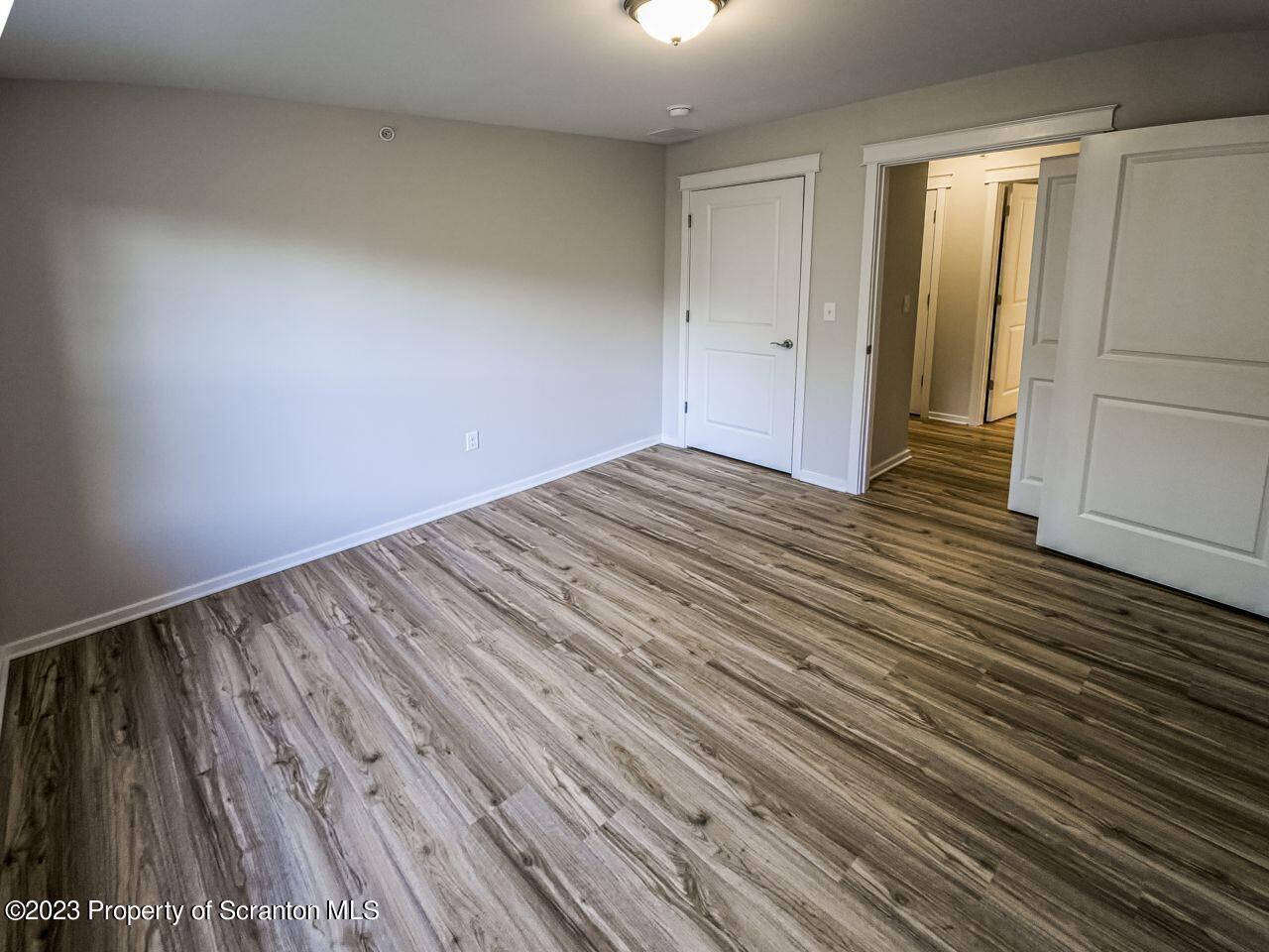 163 Bianca Way Old Forge, PA 18518 - Photo 14 of 24 a view of empty room with wooden floor