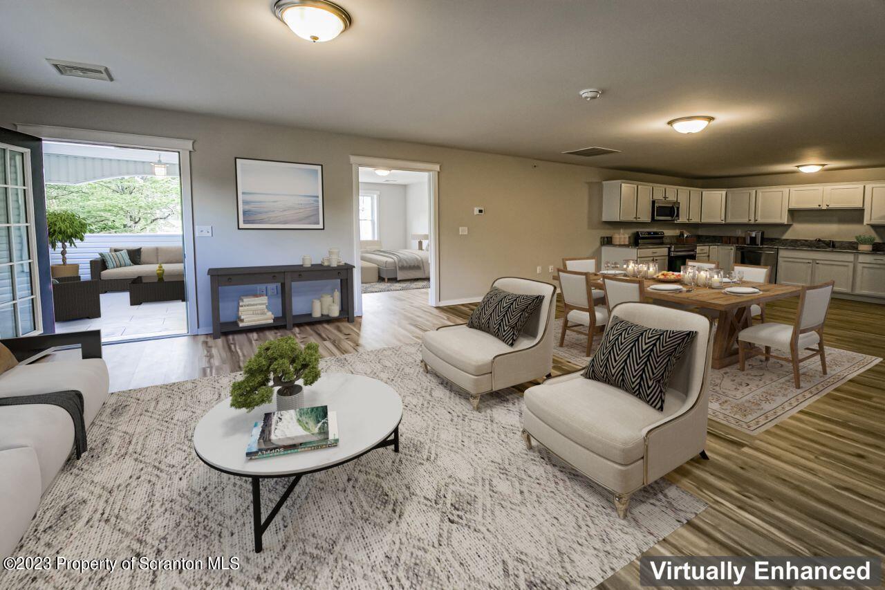 163 Bianca Way Old Forge, PA 18518 - Photo 5 of 24 a living room with furniture kitchen view and a large window