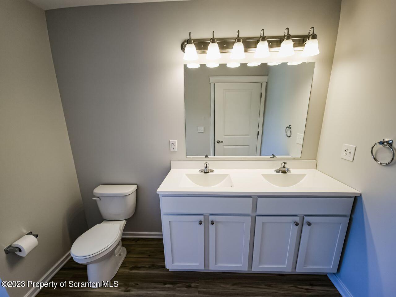 163 Bianca Way Old Forge, PA 18518 - Photo 10 of 24 a bathroom with a sink toilet and mirror