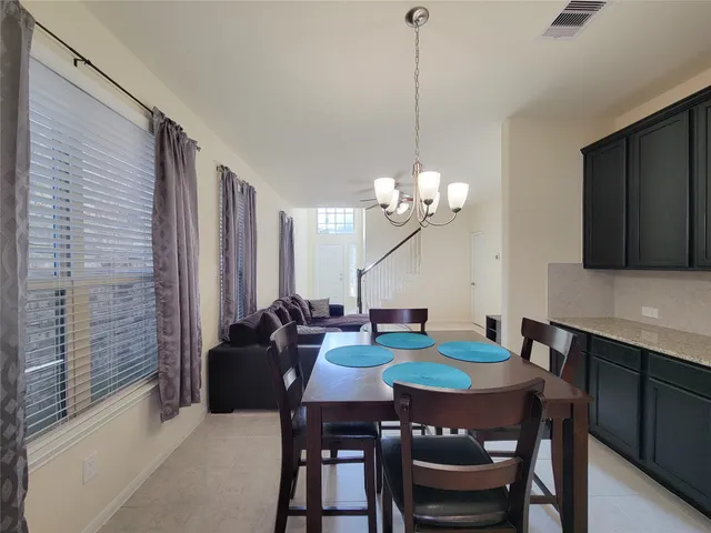 a view of a dining room with furniture