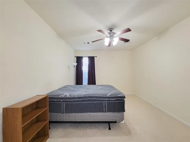 a room with a bed and a chandelier