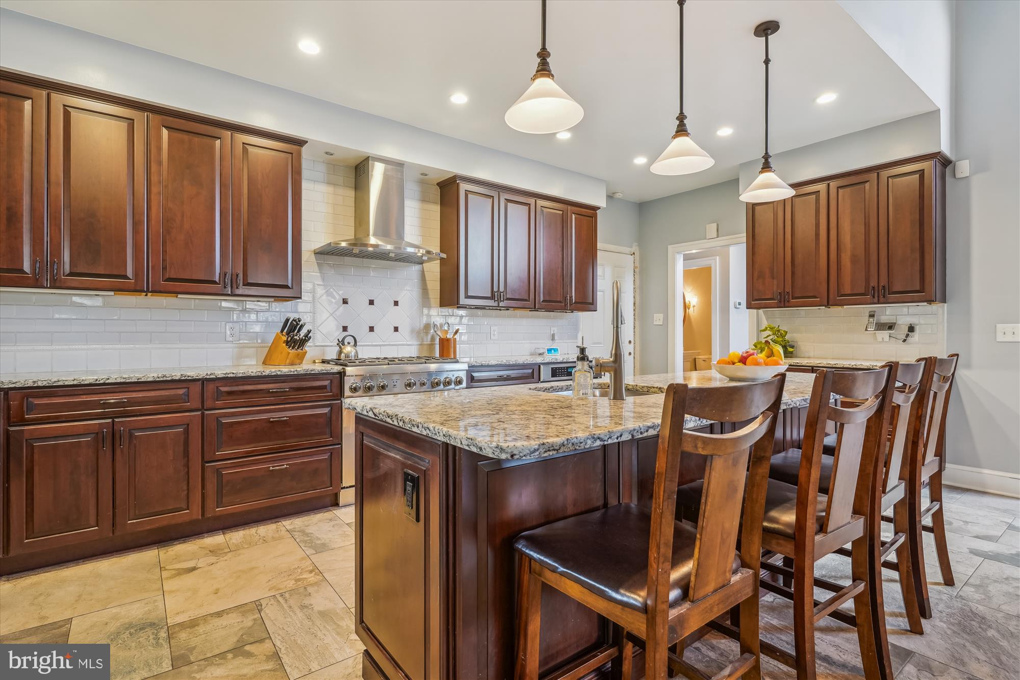 6100 Solitaire Way McLean, VA 22101 - Photo 12 of 60 a kitchen with granite countertop a sink stove and cabinets