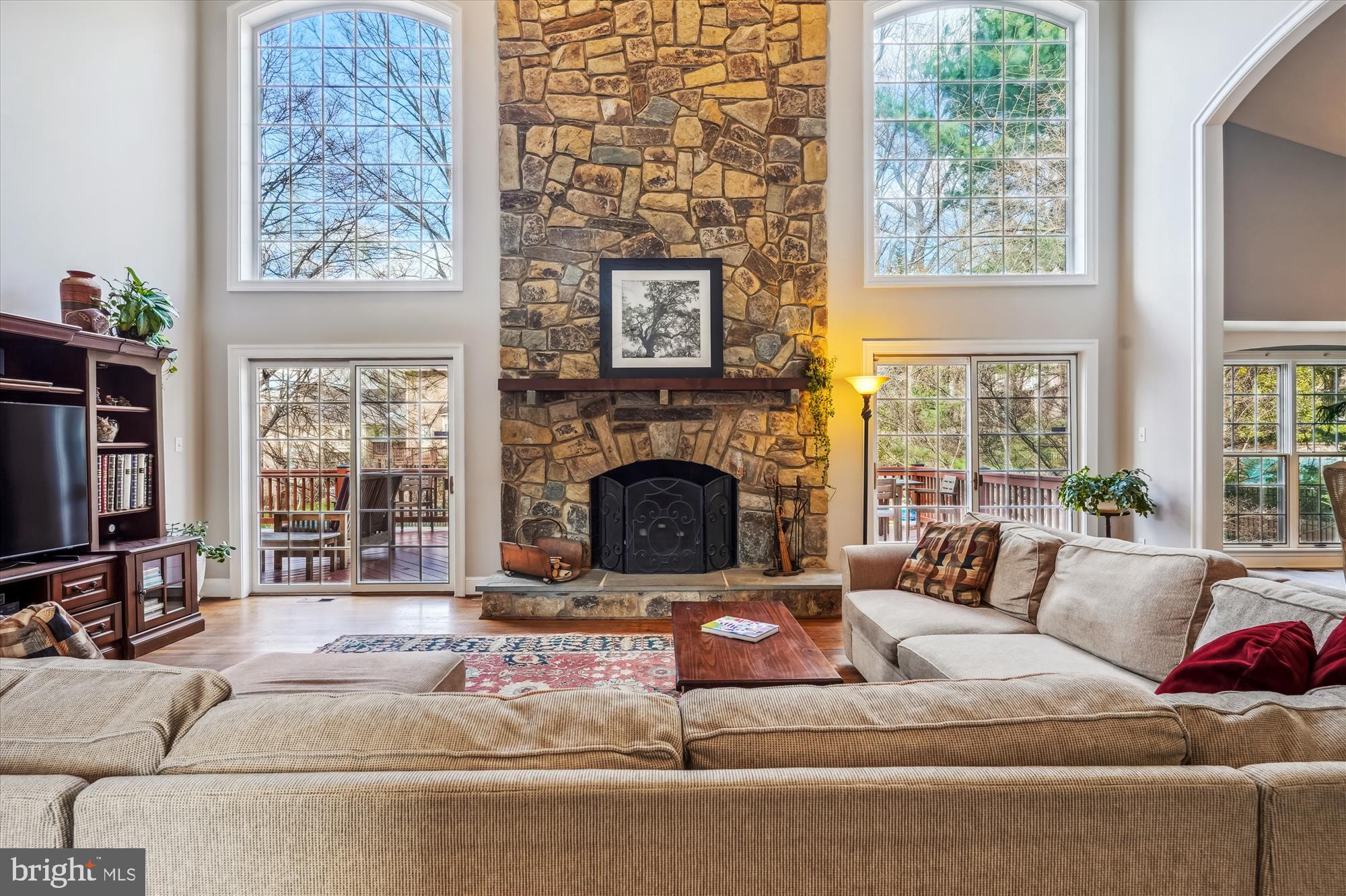 6100 Solitaire Way McLean, VA 22101 - Photo 2 of 60 a living room with furniture large window and a fireplace