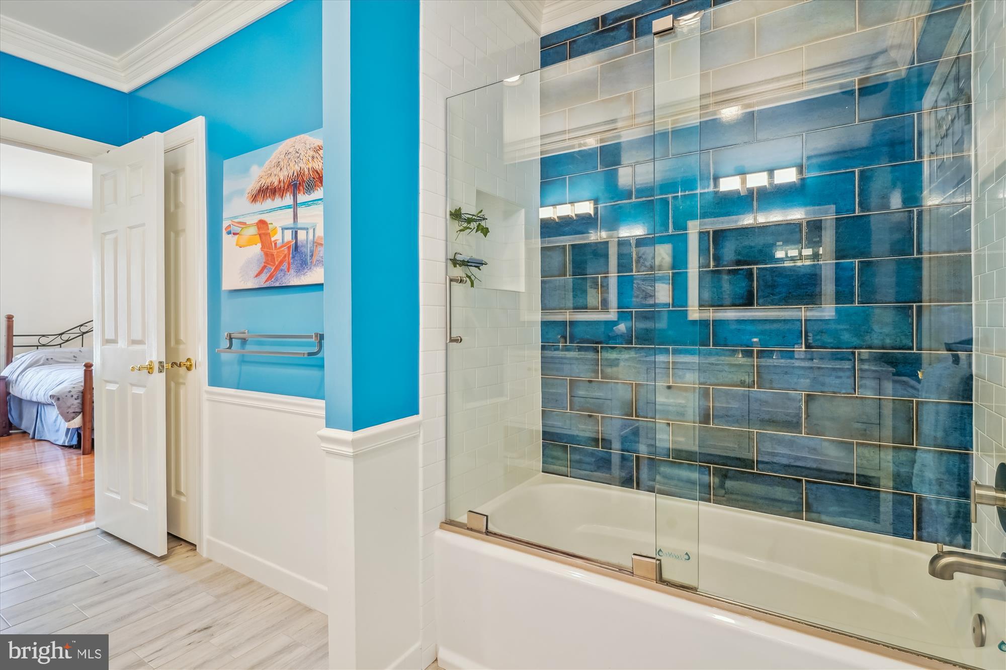 6100 Solitaire Way McLean, VA 22101 - Photo 31 of 60 a bathroom with a bathtub and a shower