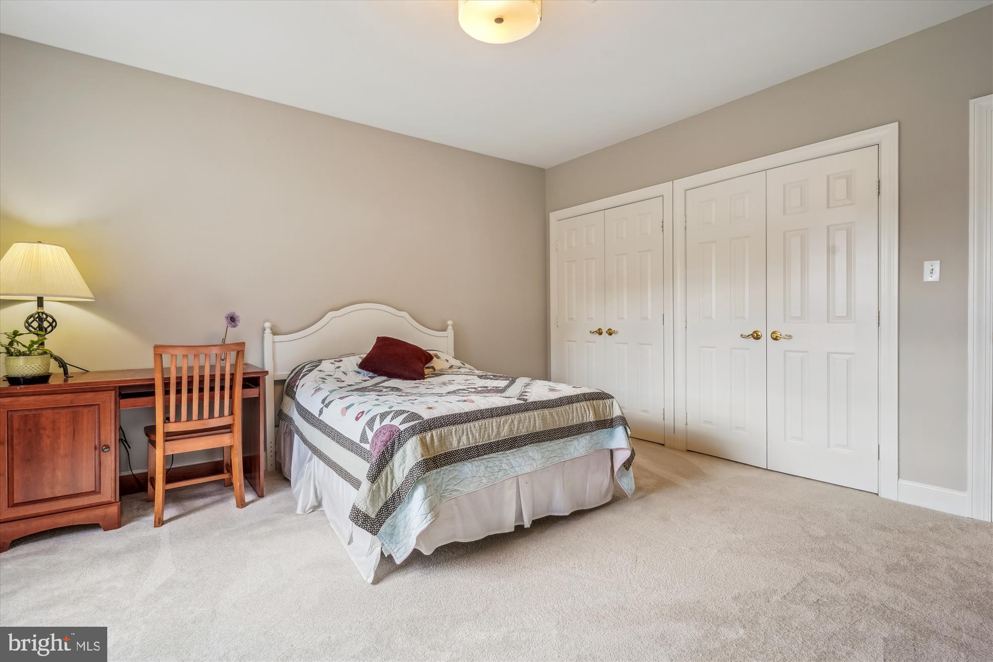 6100 Solitaire Way McLean, VA 22101 - Photo 34 of 60 a bedroom with a bed and a lamp on table