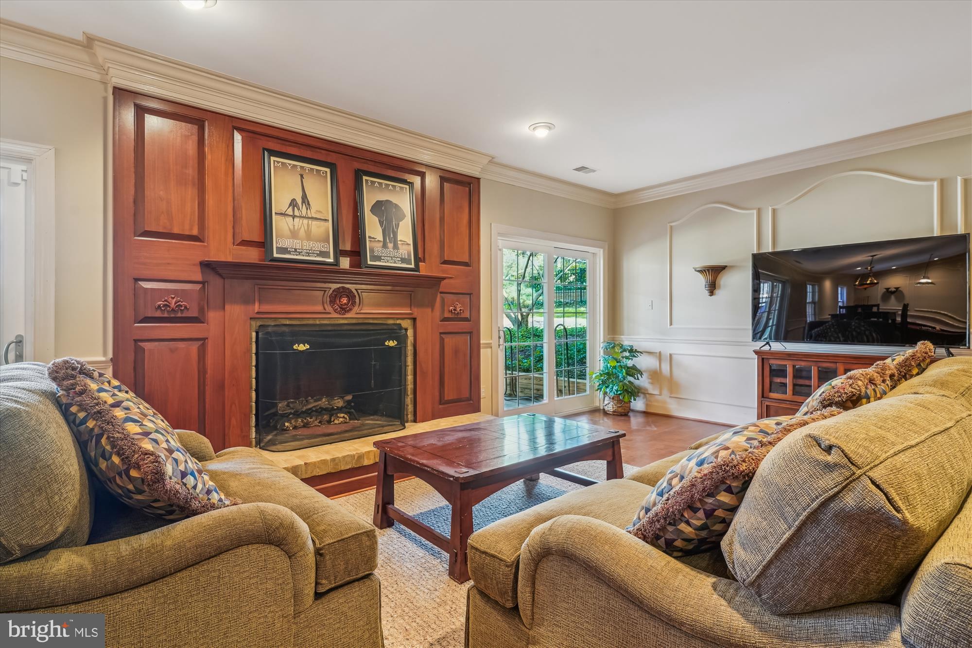 6100 Solitaire Way McLean, VA 22101 - Photo 40 of 60 a living room with furniture a fireplace and a floor to ceiling window